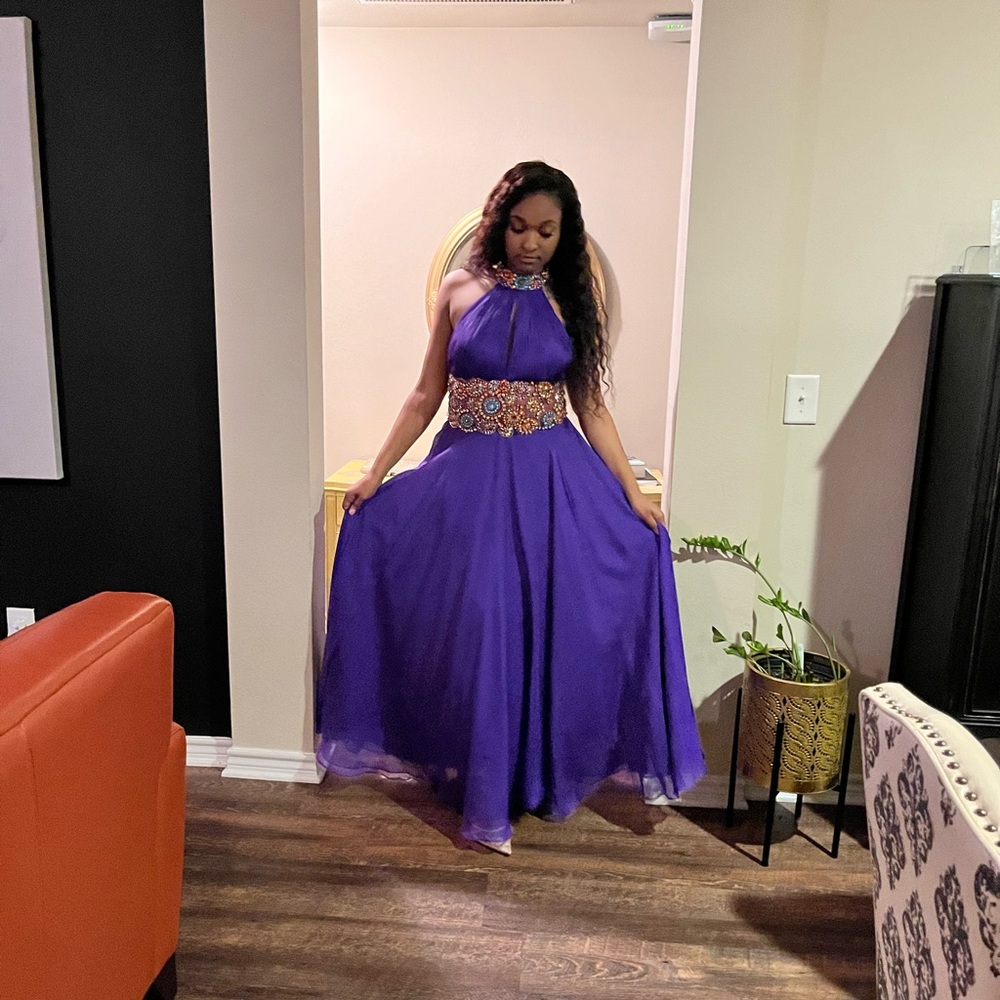 Purple formal halter gown with beautiful jewel tone embellished neck and waist.